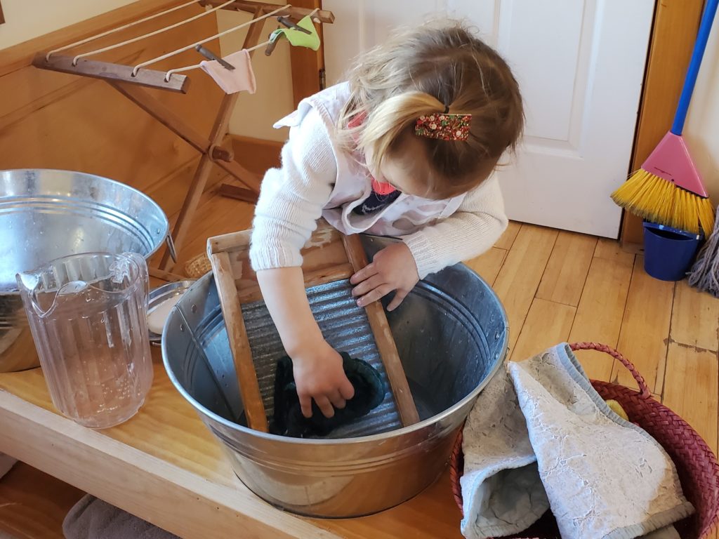 Child Washing Clothes