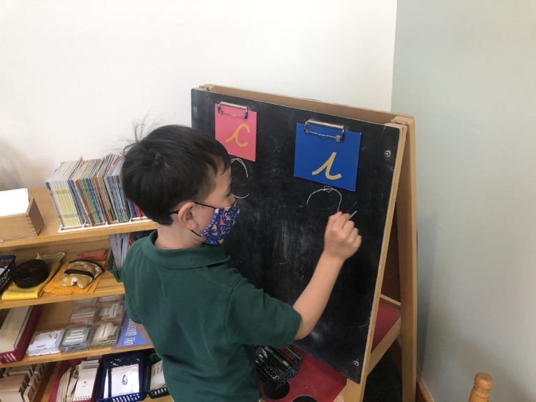 Child practicing writing letters