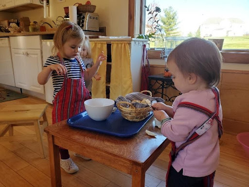 Toddlers Preparing Snack in Classroom