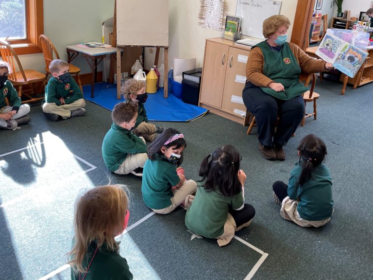 Teacher Reading Aloud to Students