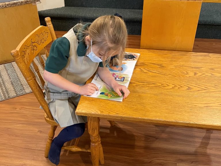 Student Reading in Class